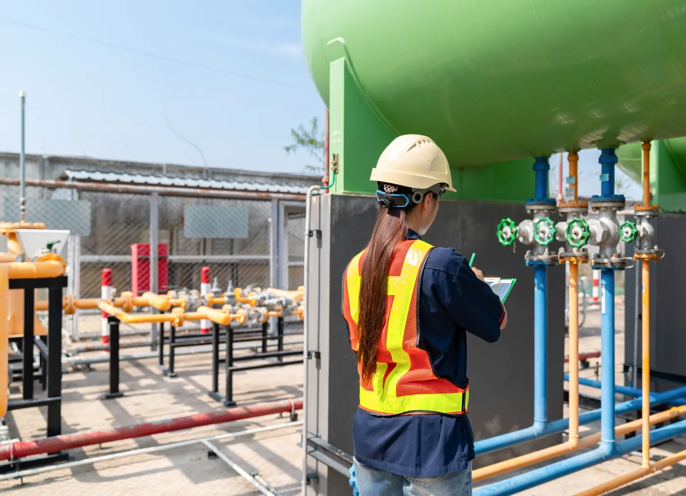 Inspector examining a pressure vessel at an energy fabrication yard