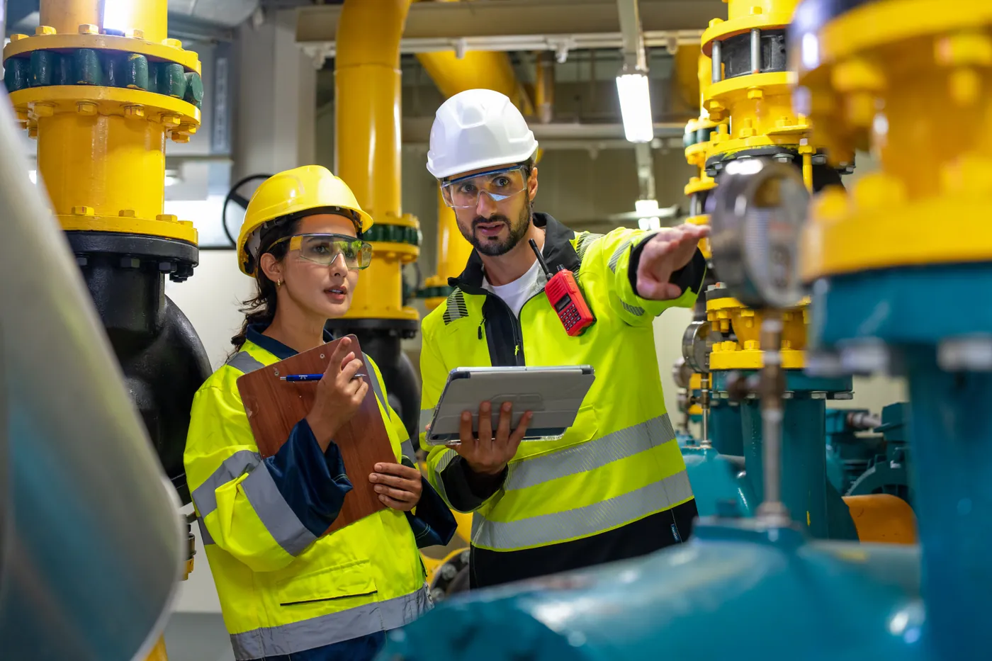 Third party inspector examining fabricated equipment at a manufacturing facility