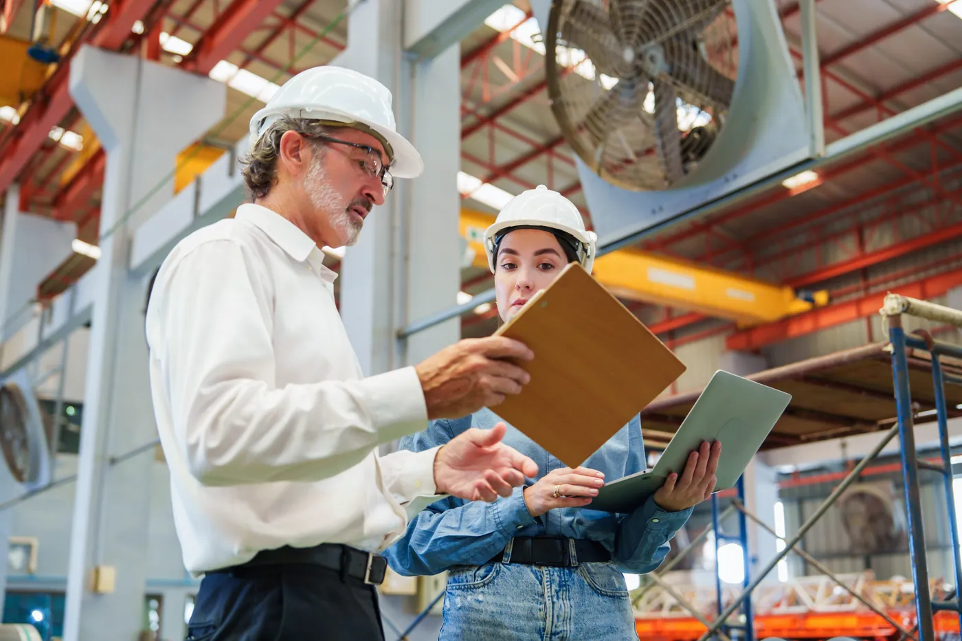 Inspector reviewing material certificates against project specifications